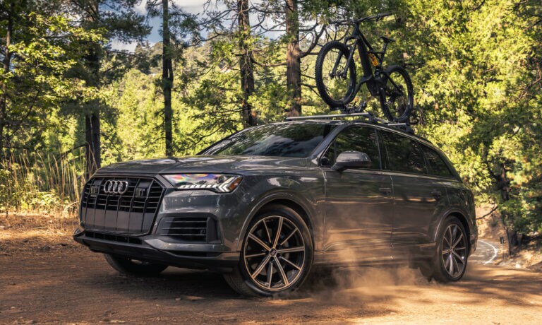 2022 Audi Q7 exterior driving in the woods with a bike rack