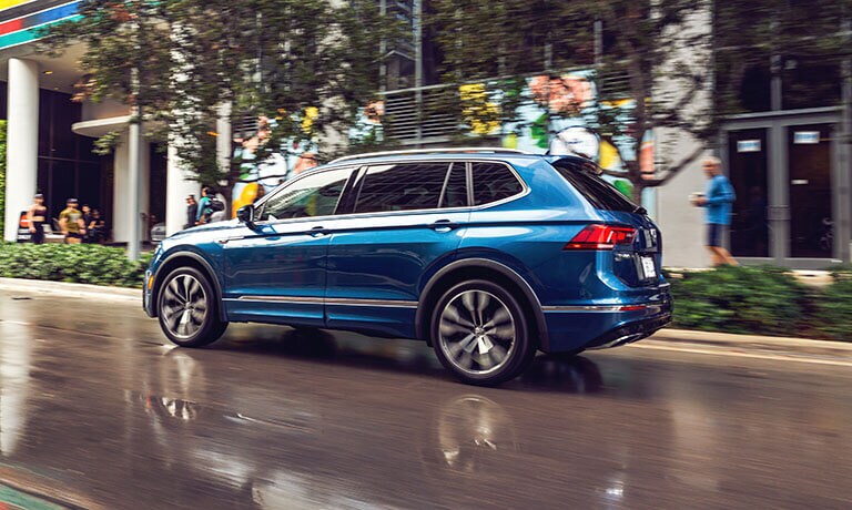 Volkswagen Tiguan Exterior Driving On A Wet City Road