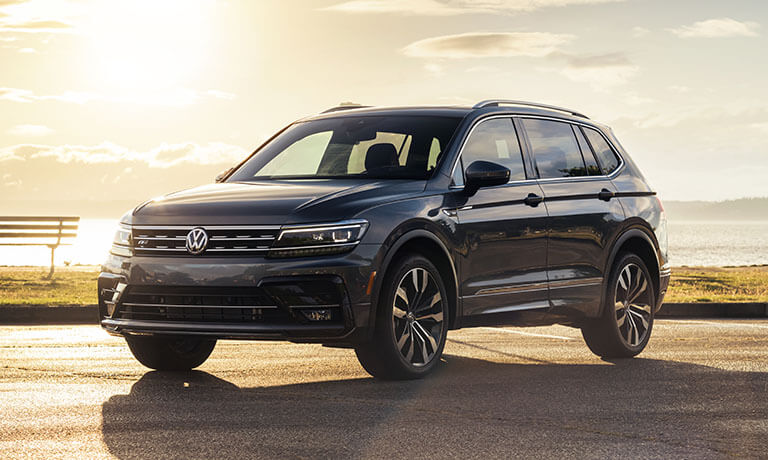 2021 Volkswagen Tiguan Exterior Parked By A Lake At Sunset