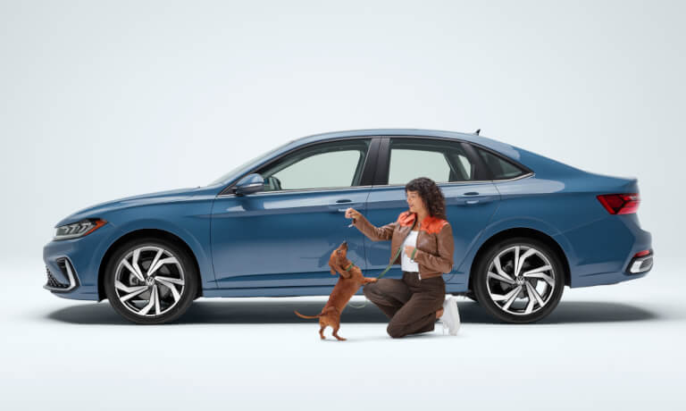 2026 Volkswagen Jetta Exterior Side View With Woman And Dog