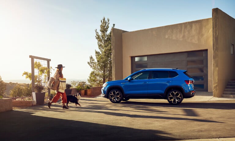 2022 Volkswagen Taos in front of a building in the sun