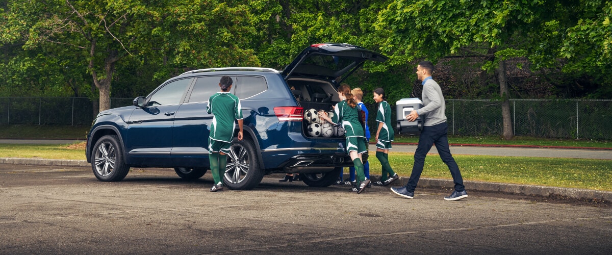 2019 Volkswagen Atlas A group of kids putting soccer equipment into the back of a Volkswagen Atlas