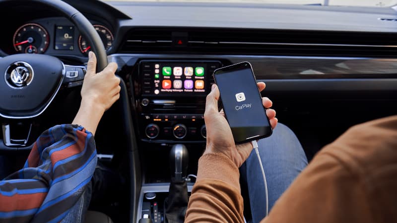 2020 VW Passat Connectivity A person syncing their phone with their 2020 VW Passat