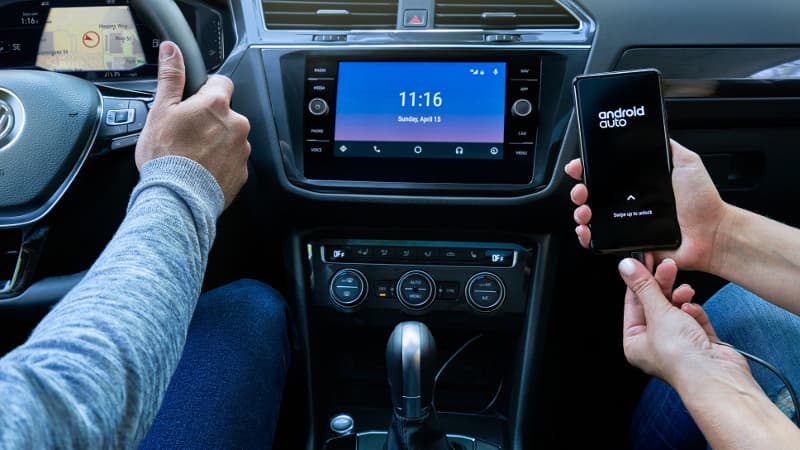 2020 VW Tiguan Connectivity A person syncing their phone with their 2020 VW Tiguan