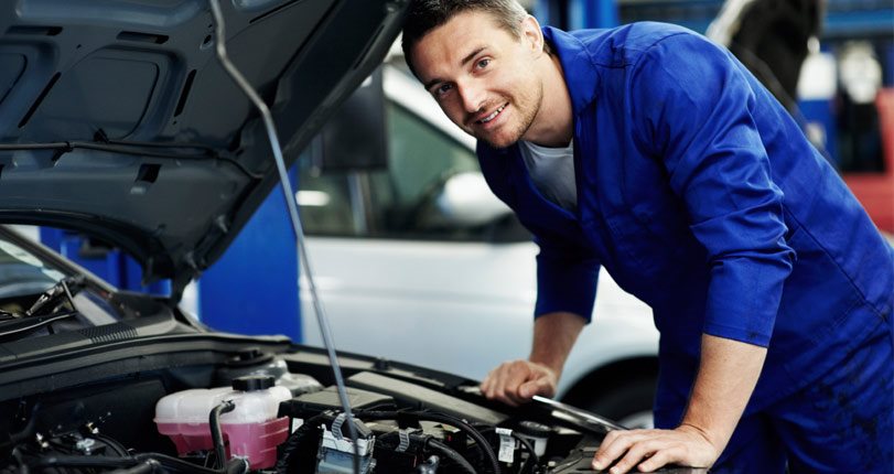 Service Center Tech Working on a Car