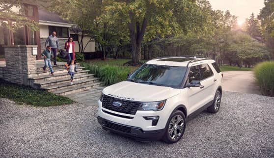 family walking to 2019 Ford Explorer