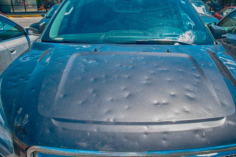 Car with hail dents on the roof being repaired at Patrick Collision Center in Schaumburg and Naperville, IL.