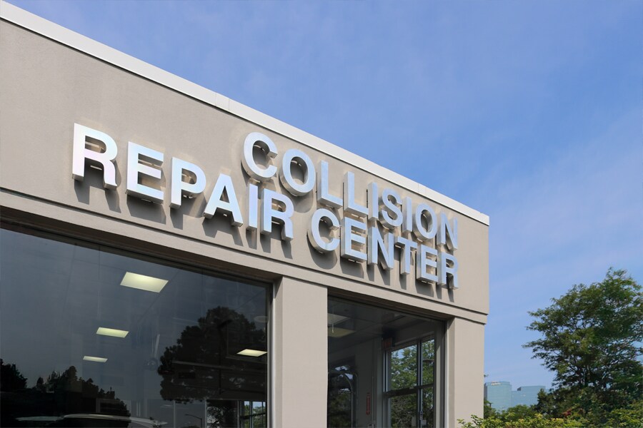 Exterior view of Patrick Collision Center buildings located in Schaumburg and Naperville, featuring clear signage and customer parking areas.