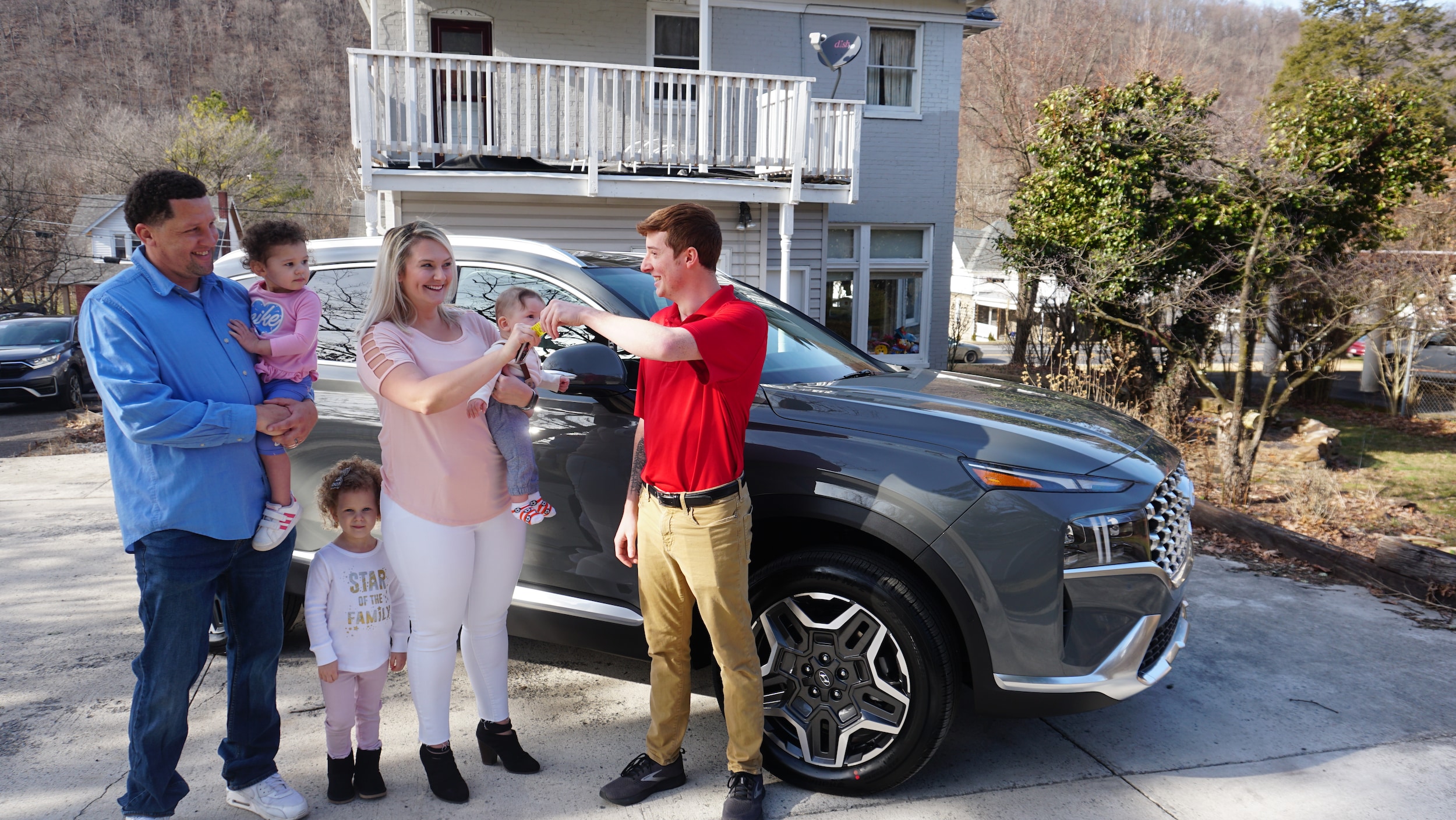 Jamie with Family-Car Delivery.jpeg