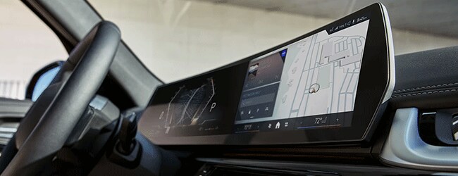 2025 BMW X1 interior with curved display and navigation screen