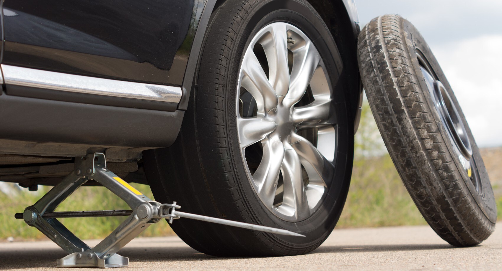 Changing a spare tire.