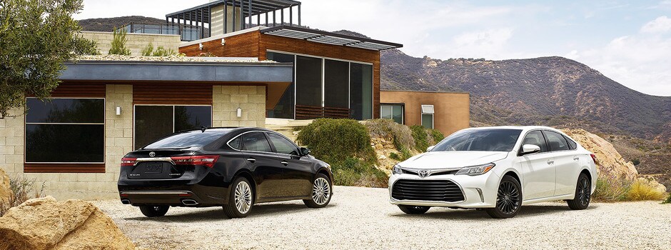 2018 Toyota Avalon parked outside home next to mountains