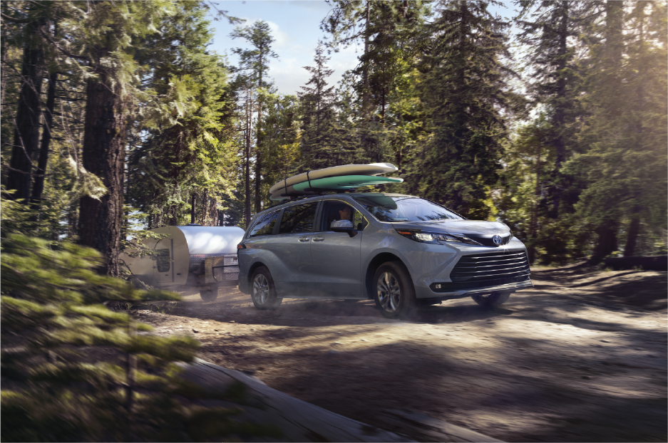 2022 Sienna - Action Shot - Camping with Trailer.png