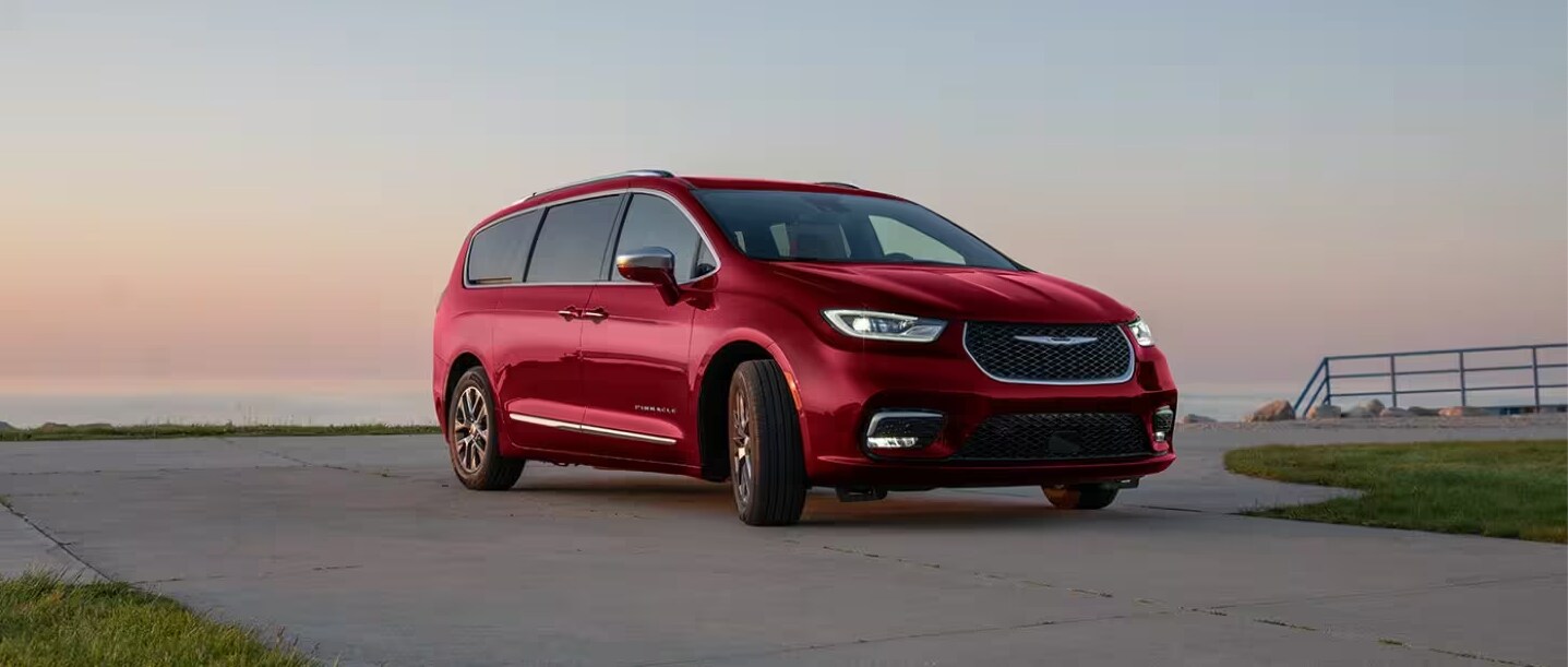 2024 Chrysler Pacifica Plug-in Hybrid in red parked on concrete 2024 Chrysler Pacifica Plug-in Hybrid in red parked on concrete