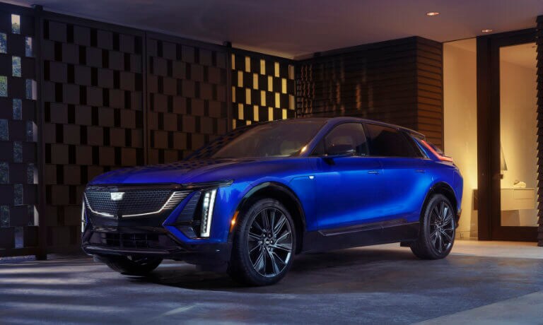 2025 Cadillac LYRIQ charging in covered driveway