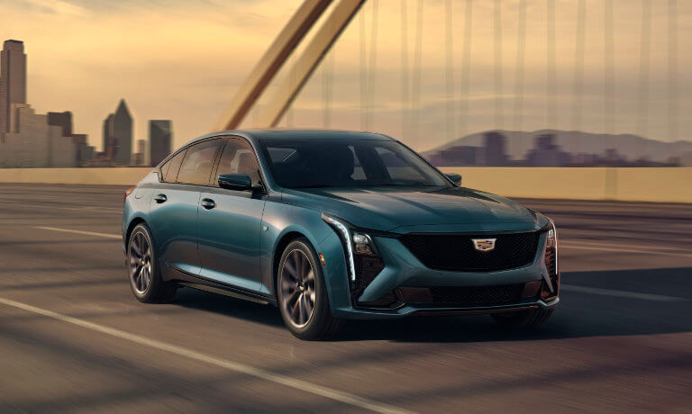 2026 Cadillac CT5 driving on a bridge