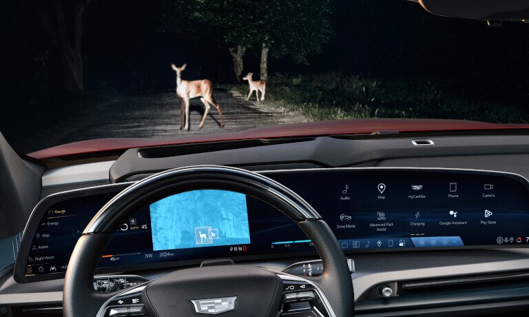 2026 Cadillac VISTIQ driving at night with safety sensors