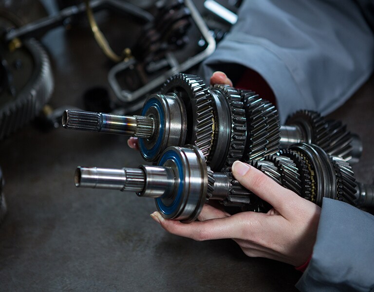 OEM Parts used at TommyCar Collision mechanic holding vehicle parts