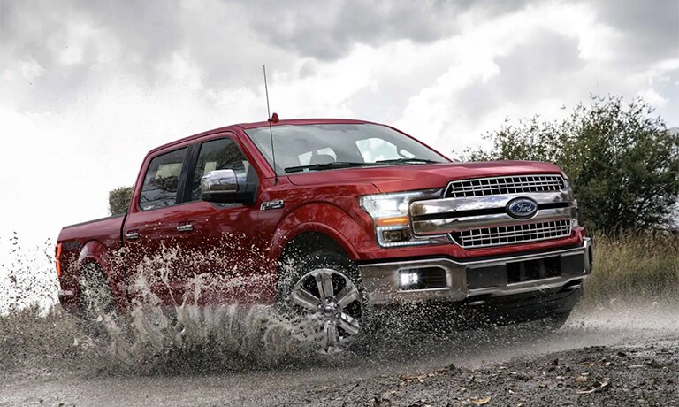 2019 Ford F-150 driving through mud