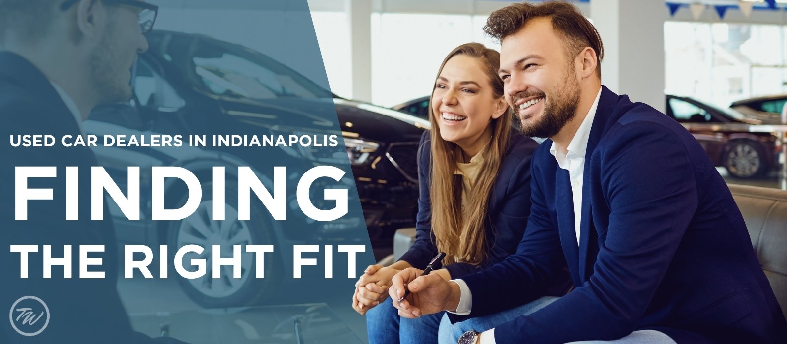 Couple smiling at a Tom Wood Automotive Group dealership while finding the right used car in Indianapolis, Indiana