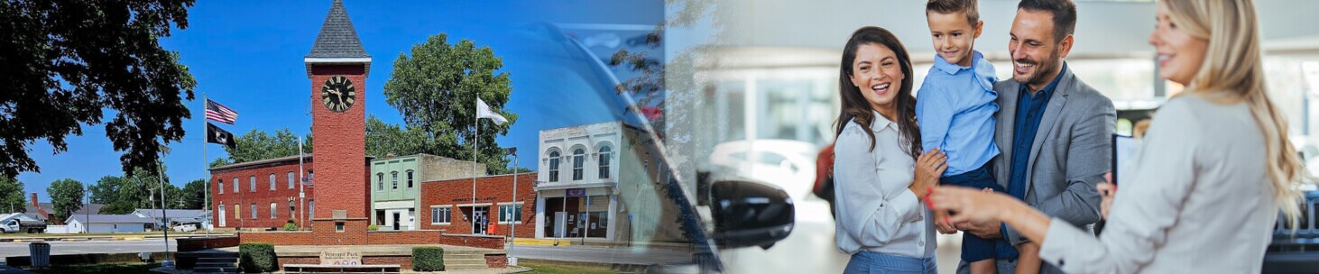 Greenfield IL clock Tower. A salesperson helps a family pick out a car.