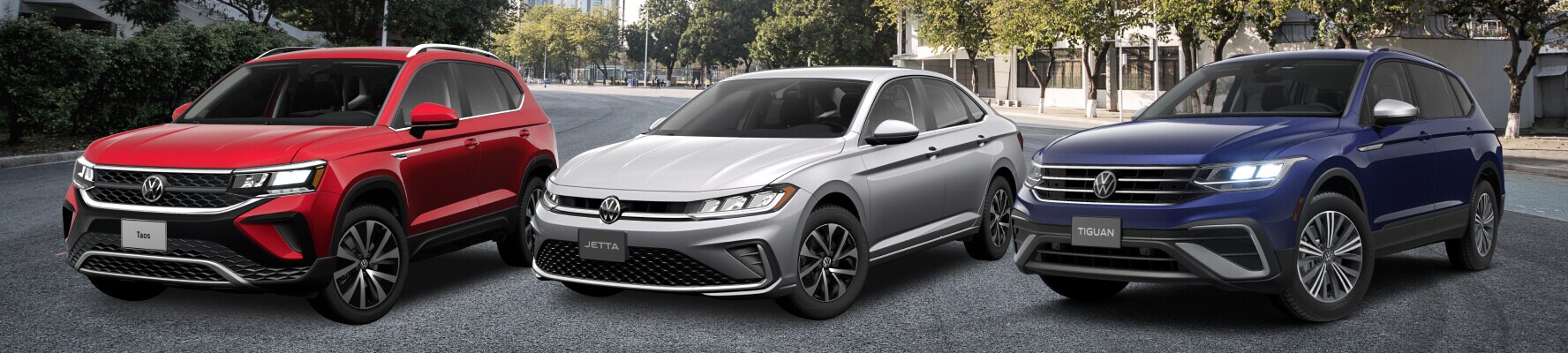 Red Volkswagen Taos, Silver Volkswagen Jetta, and Blue Volkswagen Tiguan lined up next to each other
