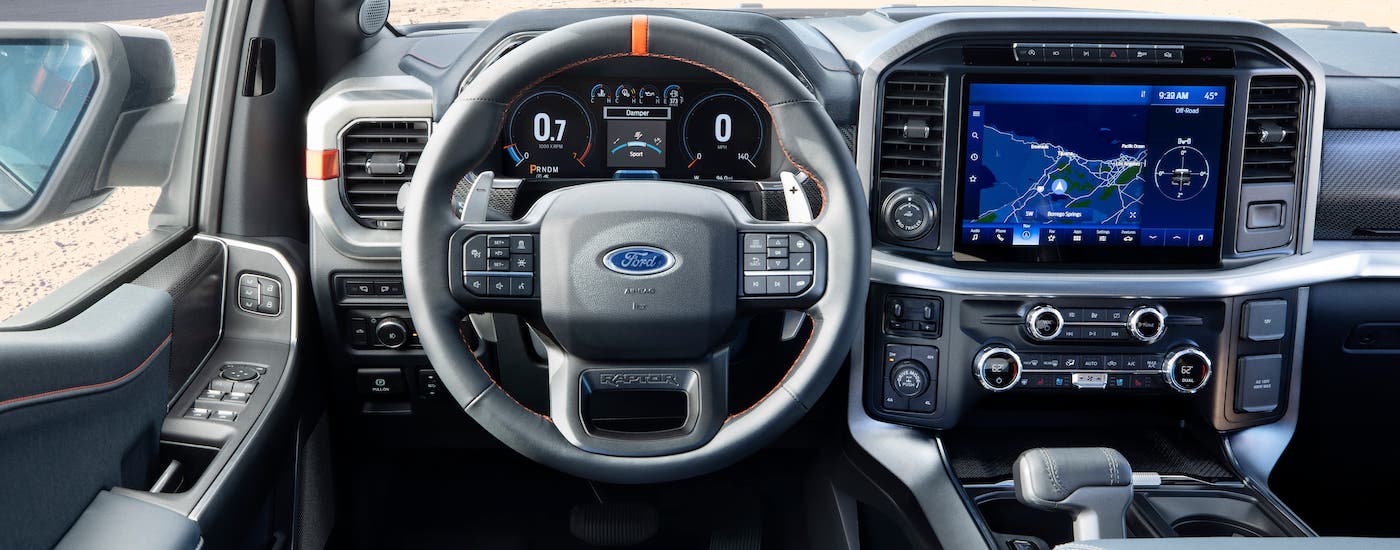 2021 Ford F-150 Raptor Gray Interior.jpg The gray steering wheel and interior of a 2021 Ford F-150 Raptor is shown.