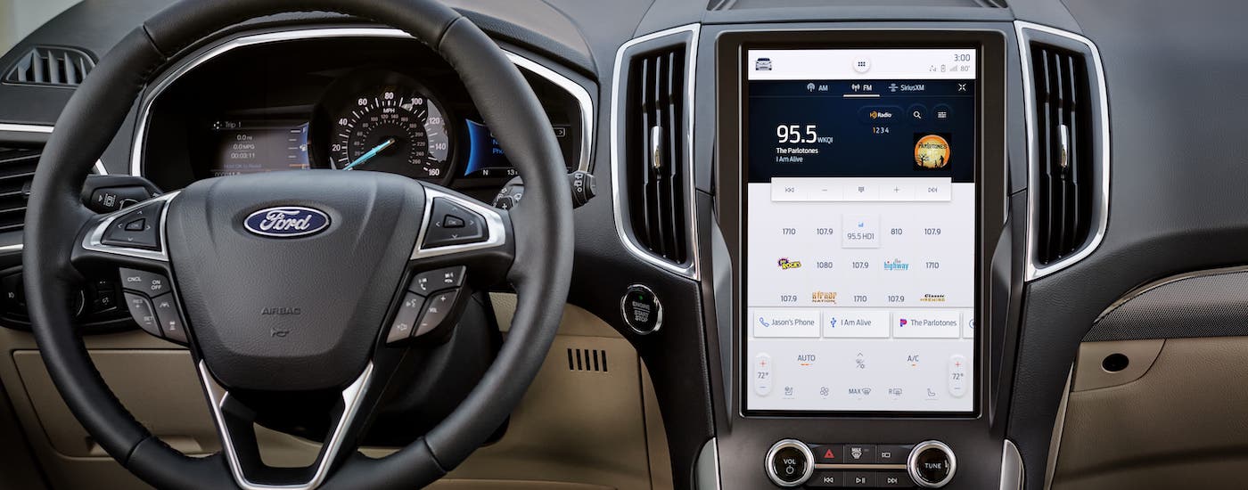 2021 Ford Edge Infotainment.jpg A closeup shows the steering wheel and large infotainment screen in a 2021 Ford Edge.