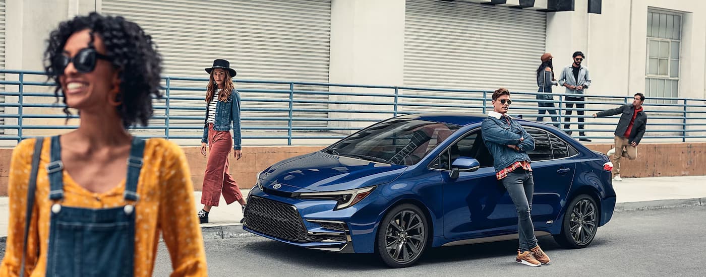 2025%20Toyota%20Corolla%20Hybrid%20SE%20AWD%20-%20Parked%20Side.jpg Blue 2025 Toyota Corolla Hybrid for sale parked on a street