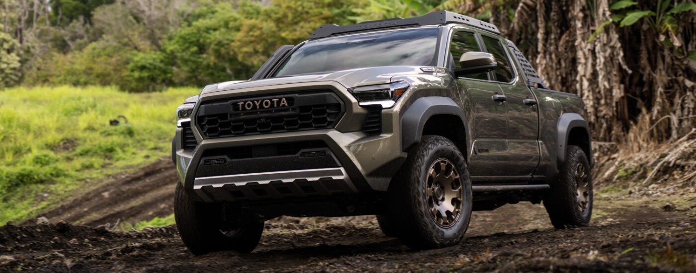 2025%20Toyota%20Tacoma%20-%20Trailhunter.png Grey 2025 Toyota Tacoma Trailhunter parked off-road