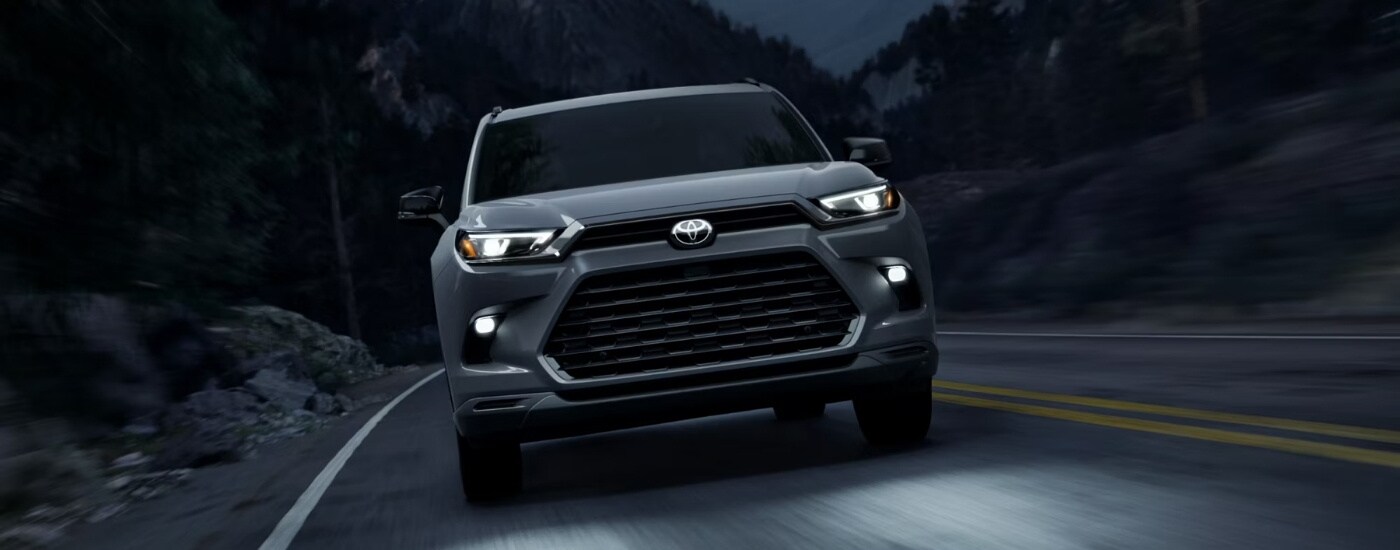 Toyota%20Grand%20Highlander%20for%20Sale%20Near%20Nashville%20-%202025%20Toyota%20Grand%20Highlander%20Hybrid%20Nightshade%20-%20Dusk.jpg Grey 2025 Toyota Grand Highlander for sale near Nashville driving at night
