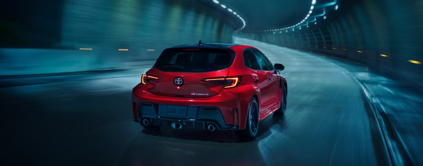 2026%20Toyota%20GR%20Corolla%20-%20tunnel.png Red 2026 Toyota Corolla Hatchback GR driving through a tunnel