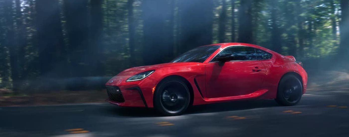 A red 2022 Toyota GR86 from the side after leaving a used car dealership in Hopkinsville.