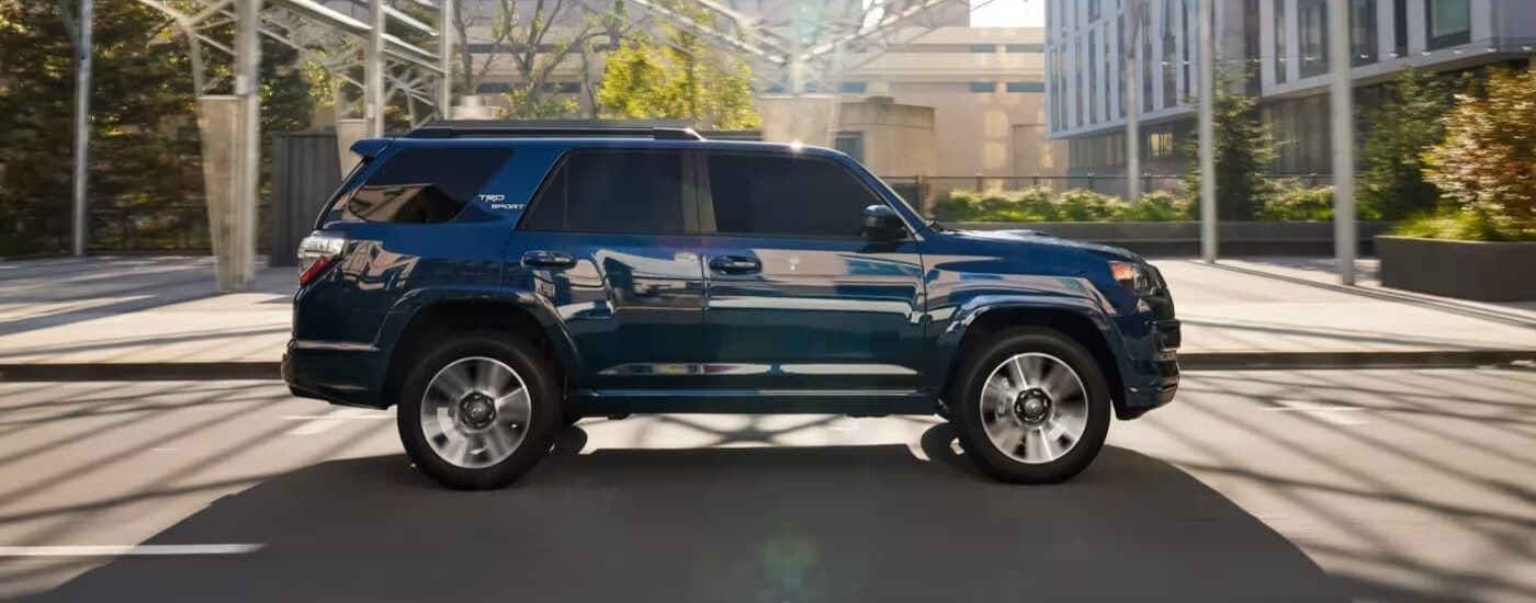 2023%20Toyota%204Runner%20TRD%20Sport%20-%20Sunny.jpg Blue 2023 Toyota 4Runner TRD Sport driving through a city