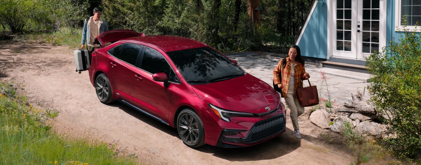 2026%20Toyota%20Corolla%20-%20people.png Two people walking next to a red 2026 Toyota Corolla