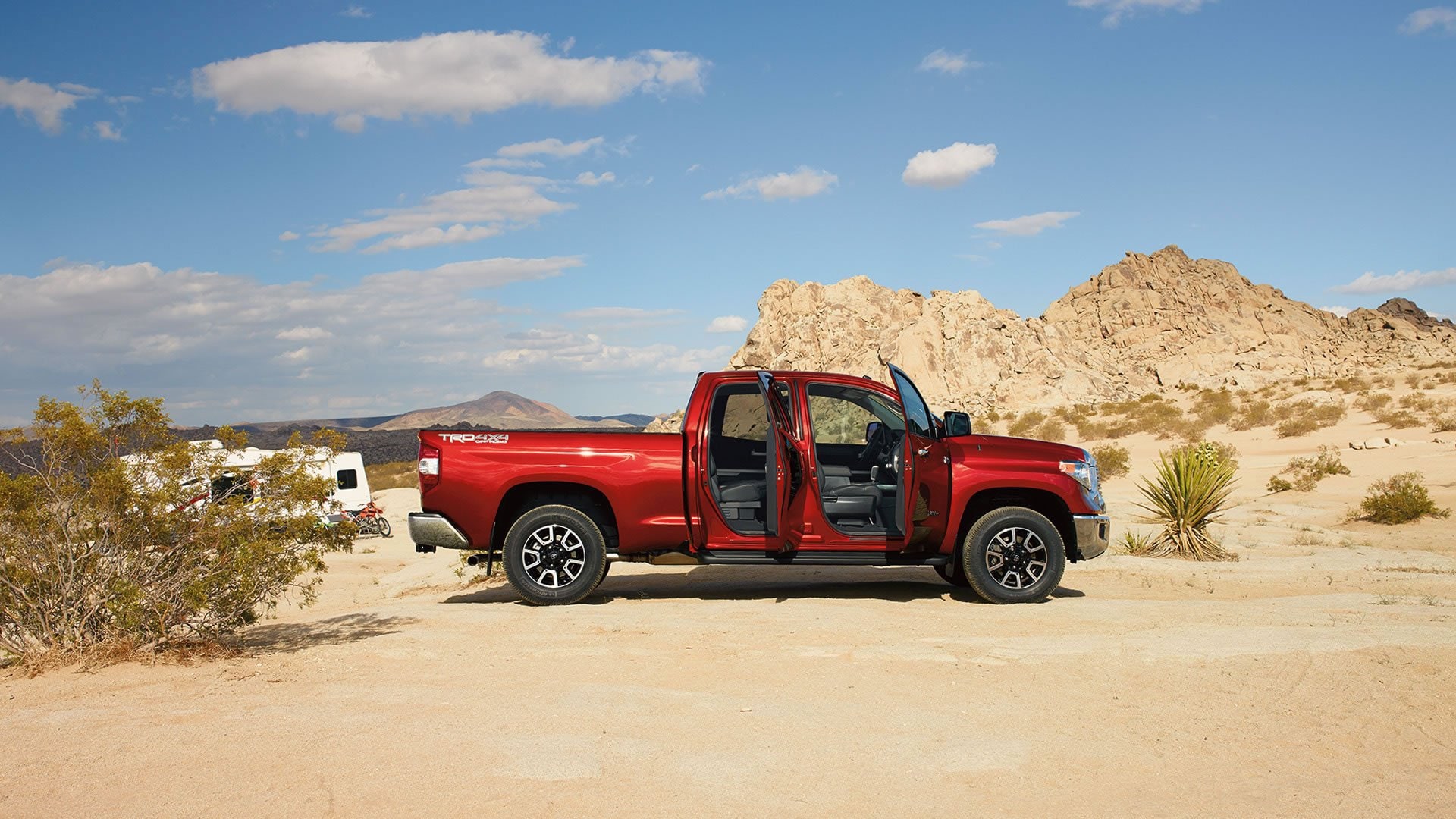 red_toyota_tundra_doors_open.jpg