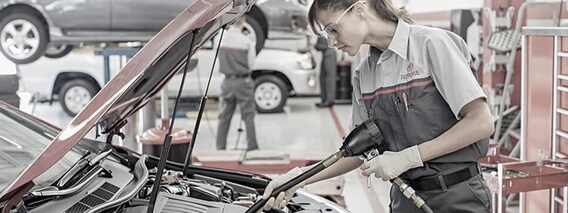 Road Trip Check Up Service Tech with Open Vehicle Hood