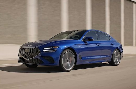 The 2025 Genesis G70 is equipped with a standard 10.3-inch touchscreen infotainment system that sits on a sleek dashboard.