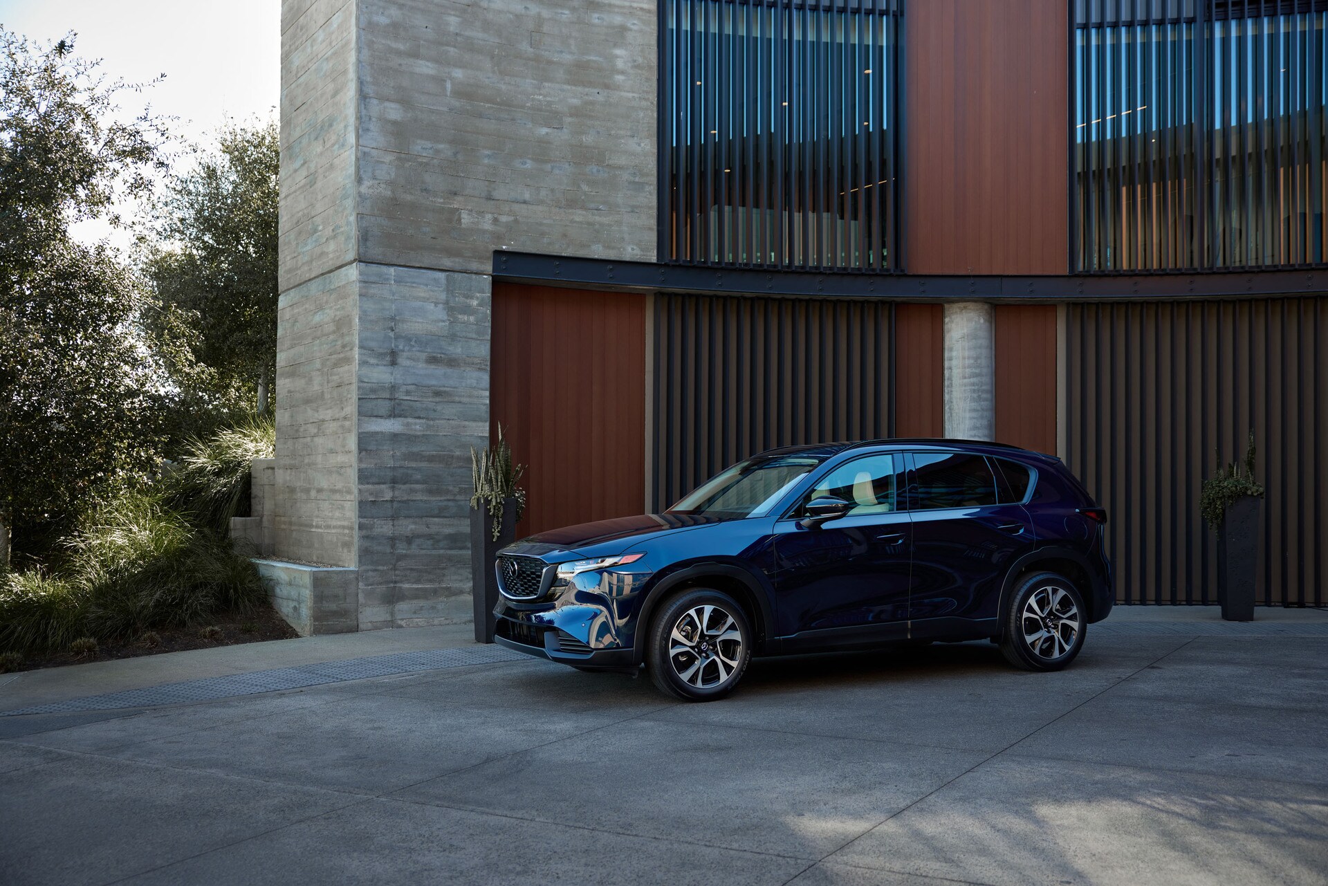 The new Mazda CX-5 parked outside of a building