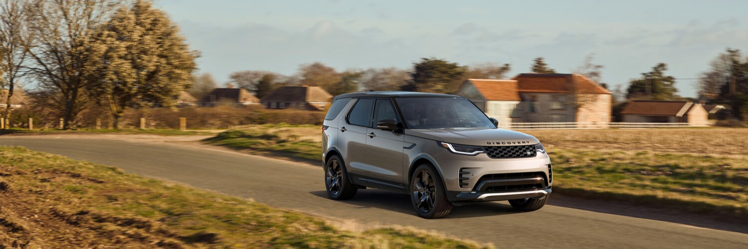 Discovery SUV Discovery SUV driving on a road outside of a neighborhood