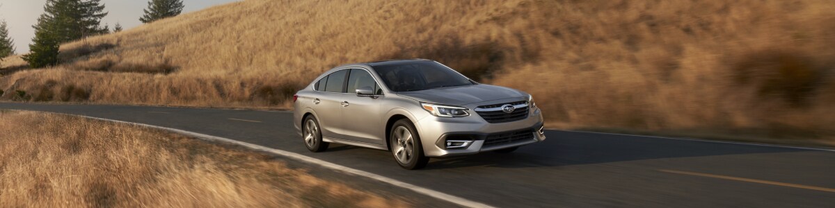All new Subaru Legacy on the road.jpg New Subaru Legacy on a county road