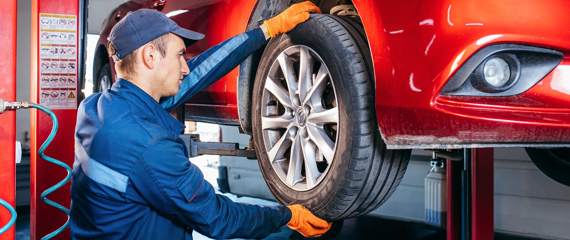 Why Service with Valley River Chevrolet Technician performing service on a tire