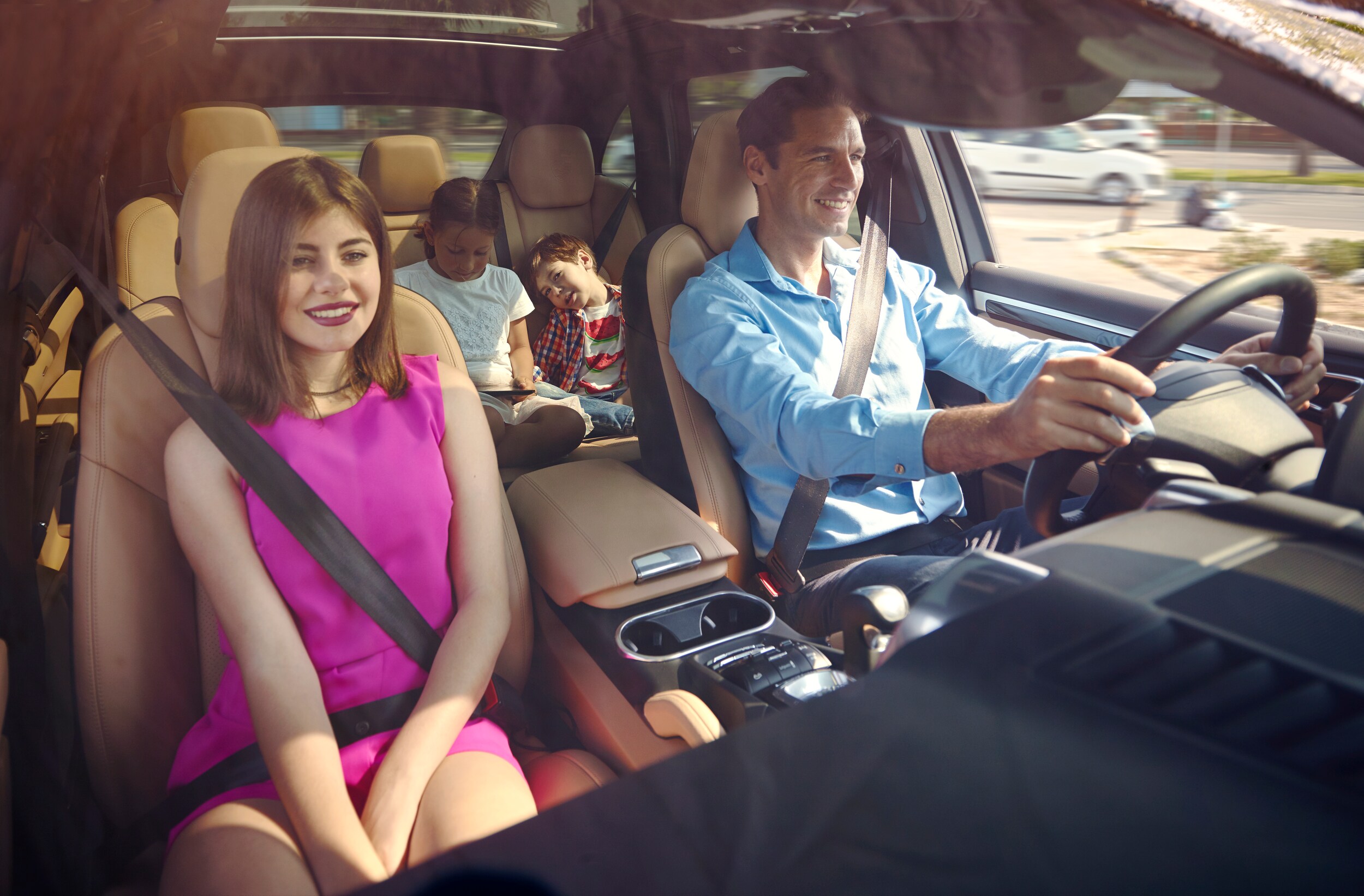 best-used-suvs-for-families-phil-long-valucar-academy-dealership-colorado-springs.jpg Happy family driving a used SUV
