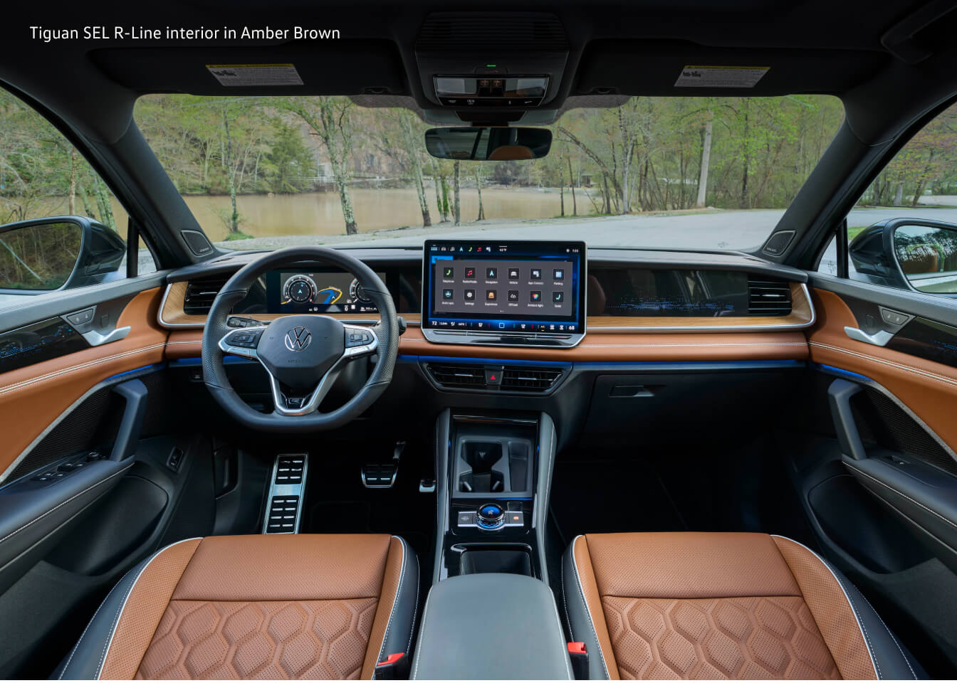 Dashboard view focusing on the large center infotainment screen of a Volkswagen Tiguan SEL R-Line.