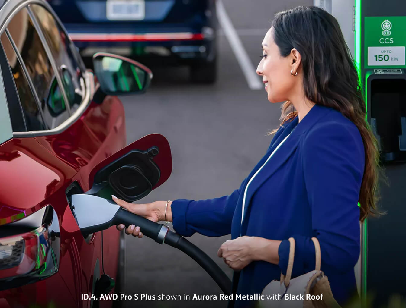 Woman charging her Volkswagen ID.4 using an Electrify America Fast Charger