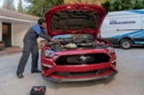 Volvo Certified Technician performing mobile service