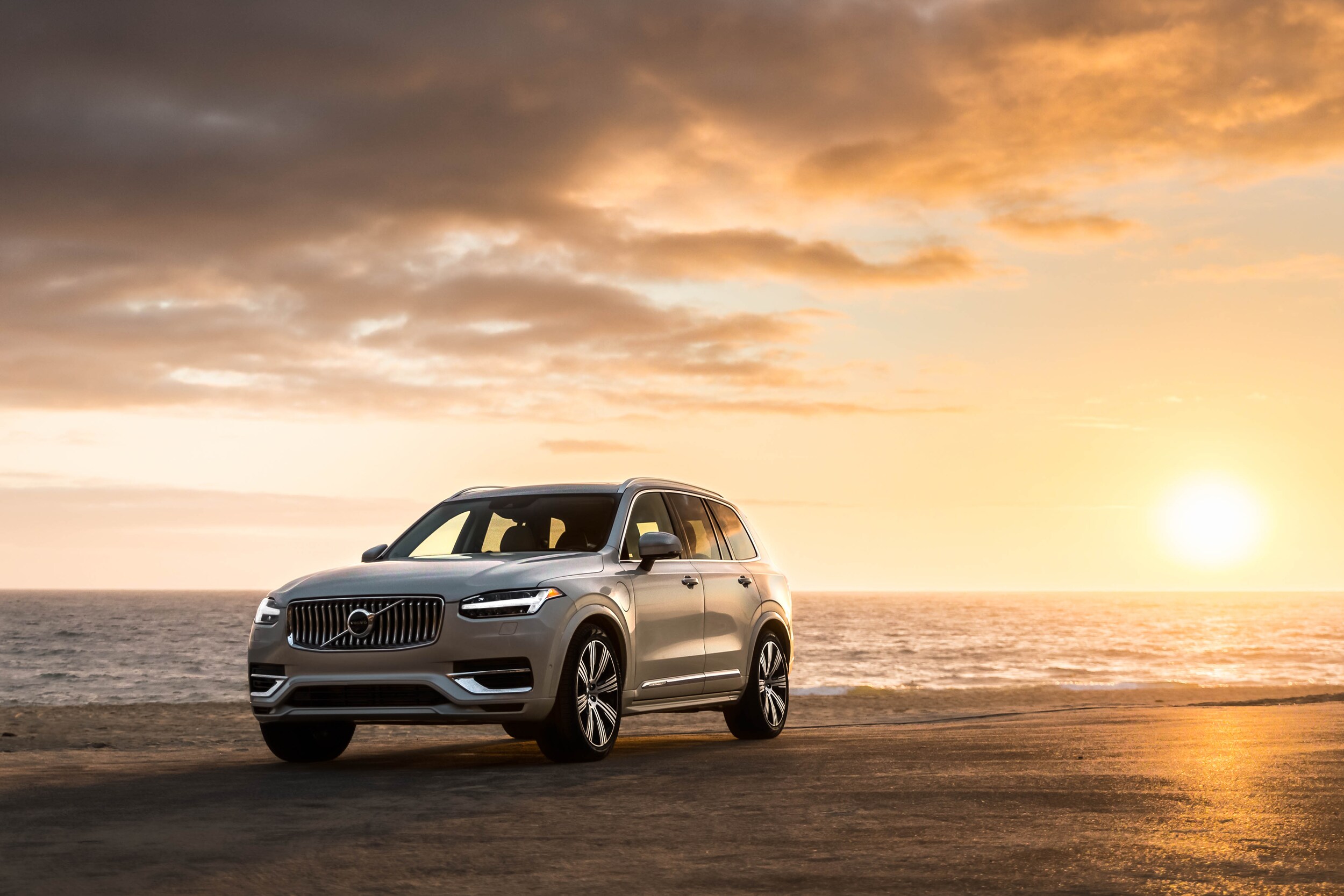 Volvo Cars New Bern is a Car Dealership near Bogue, NC | 2020 Volvo XC90 parked on the beach at sunset
