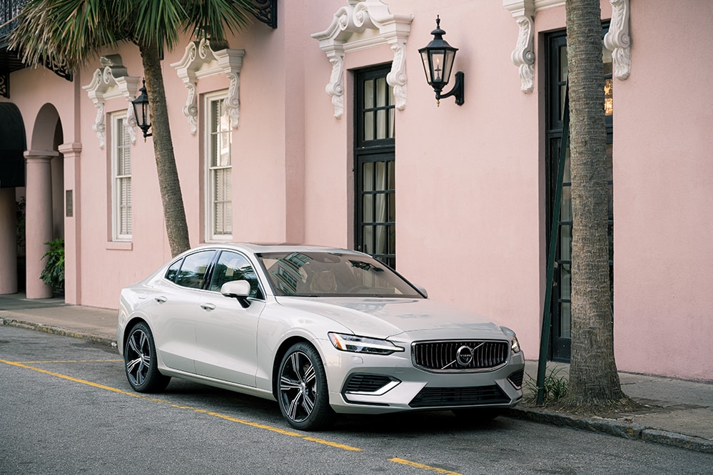 Volvo Cars New Bern is a Car Dealership near Washington NC | 2020 Volvo S60 parked infront of pink building
