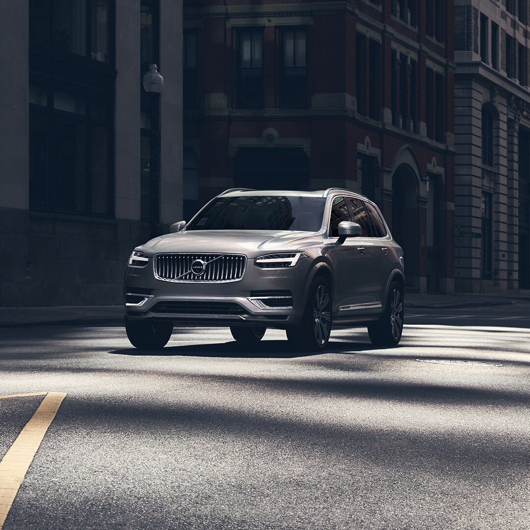 Volvo Cars New Bern is a Volvo Dealership in New Bern near Morehead City NC | Silver MY20 Volvo XC90 parked in empty city street