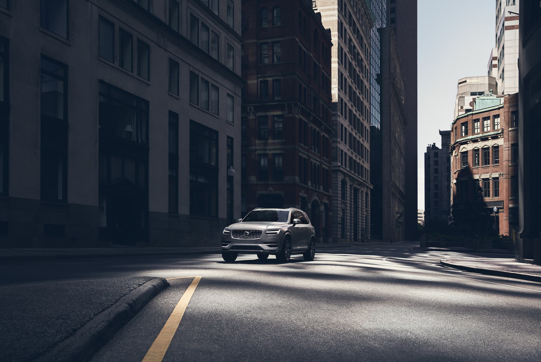 Comparison of the 2020 Volvo XC90 & the 2020 Audi Q7 at Volvo Cars New Bern of New Bern | 2020 XC90 parked in the city